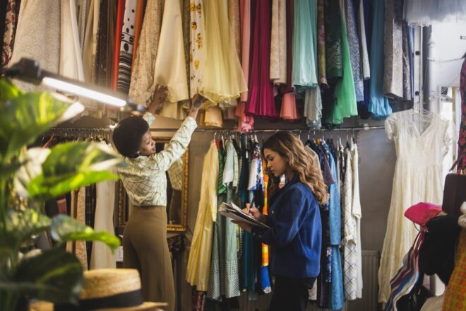 Thrift shop workers taking inventory